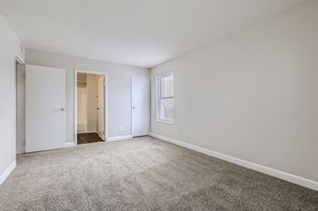 Bedroom with carpeted floor  at Hilltop View in Denver, CO.